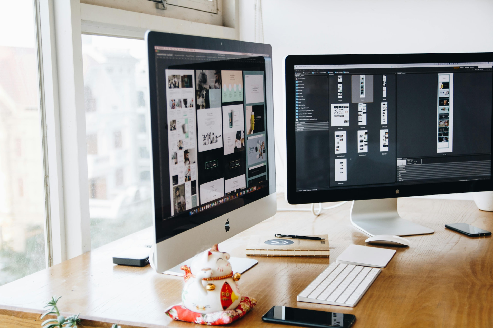 Design work shown on desktop displays in a bright studio