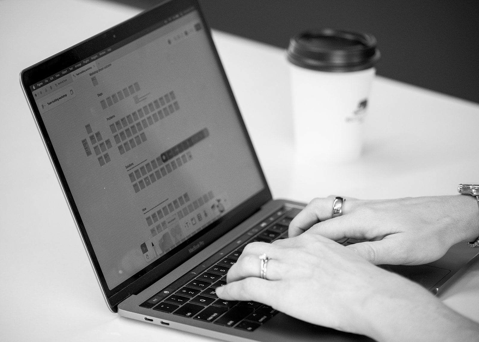 Designer working on a workshop board in Figma